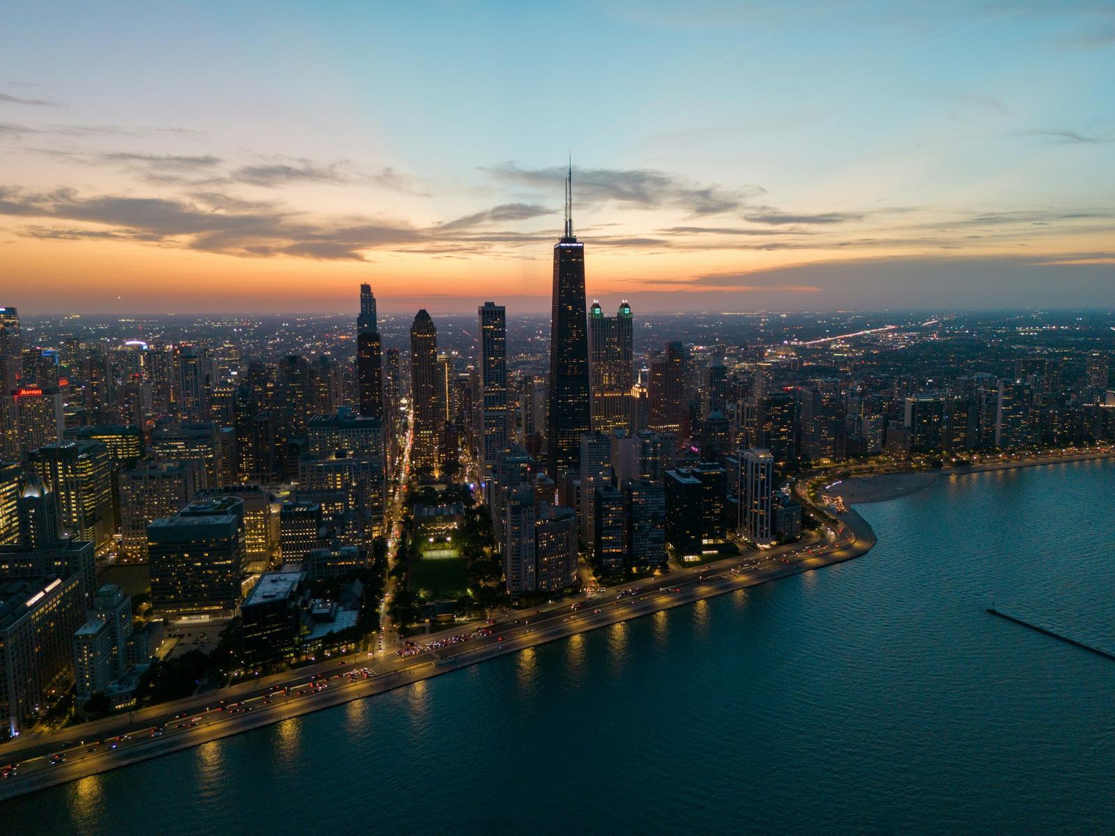 Aerial view of Chicago's lakefront and skyline at dusk